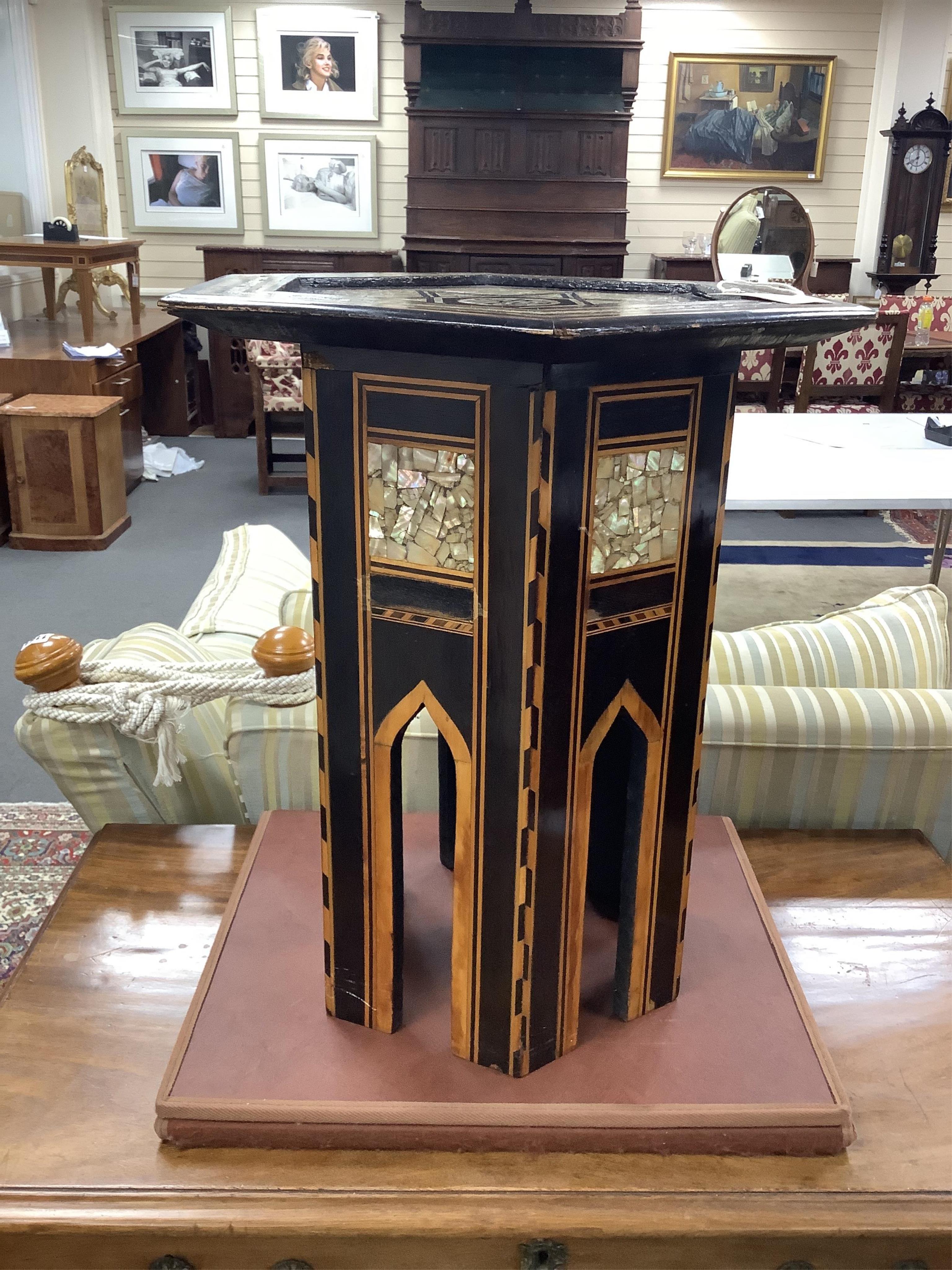 A Moorish hexagonal mother-of-pearl inlaid occasional table, width 41cm, height 51cm. Condition - good